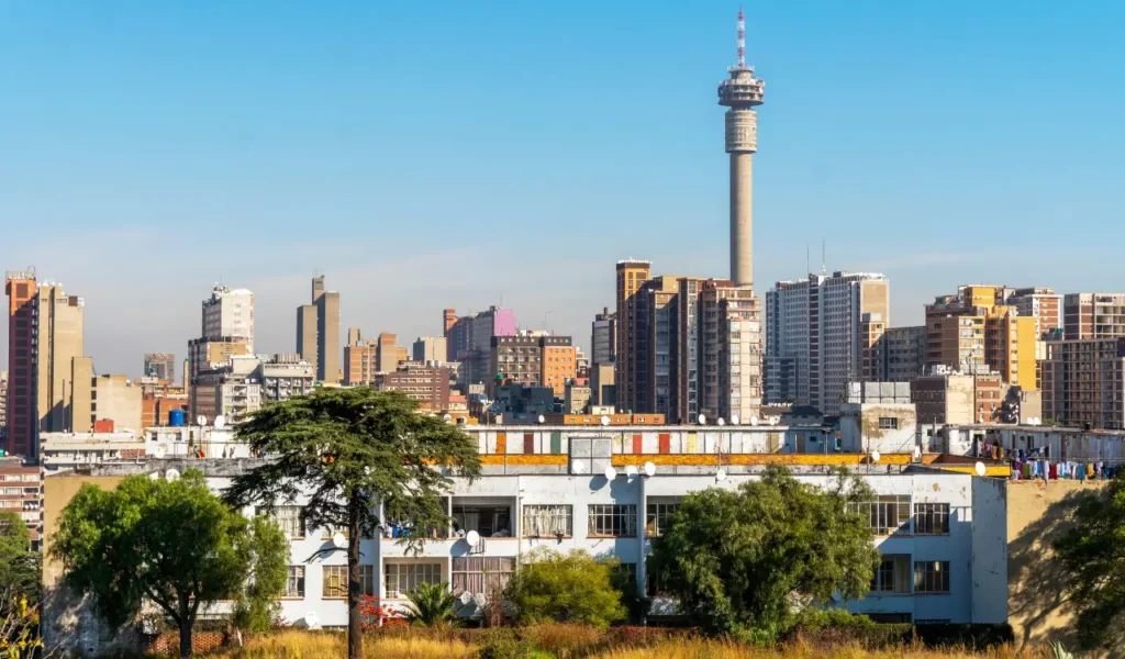 Johannesburg cityscape featuring the Hillbrow Tower, illustrating the complex urban planning, rezoning and zoning history in South Africa.