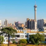 Johannesburg cityscape featuring the Hillbrow Tower, illustrating the complex urban planning, rezoning and zoning history in South Africa.